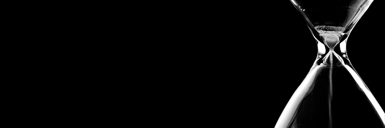 Rheumatoid Arthritis: Losing Time When Living With Chronic Illness sand running through an hourglass