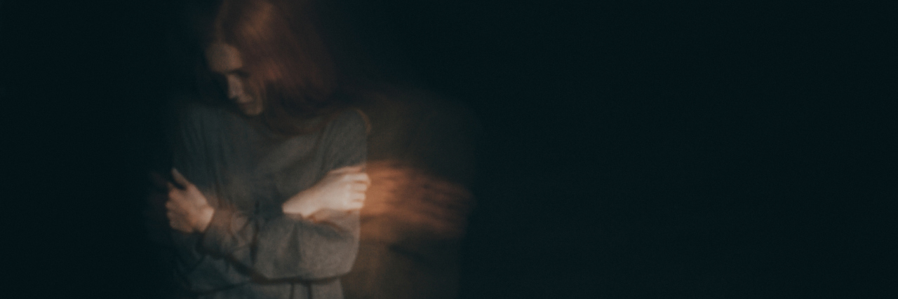 When Depression Heightens Your Sensitivities woman standing with arms crossed slightly blurred image