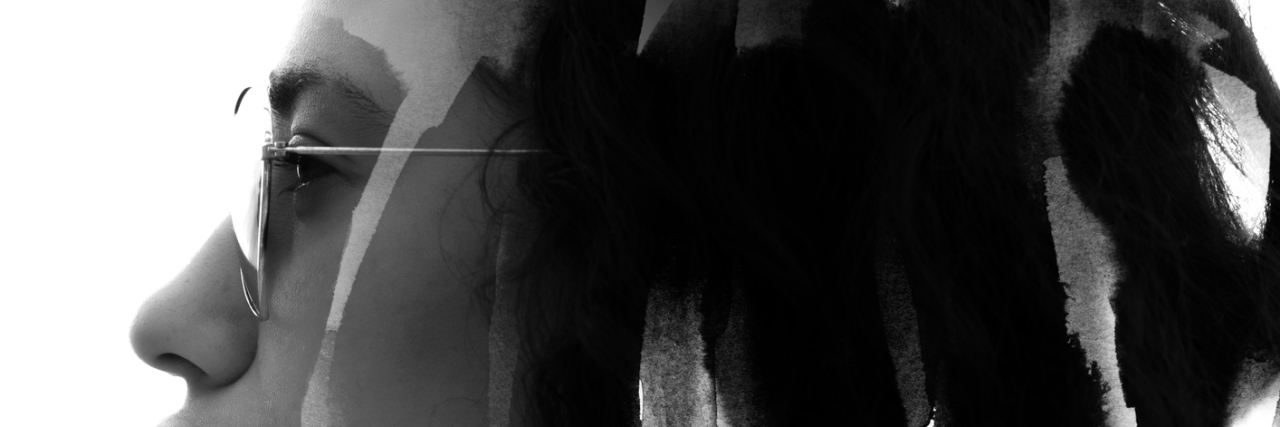 Why I Tell Loved Ones 'I Hurt Today' as Someone With Fibromyalgia black and white photo of woman wearing sunglasses