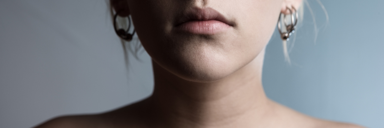 This Is Why Thyroid Cancer is Definitely Not the 'Good Cancer' Cropped woman with bare shoulders