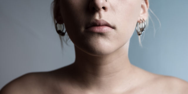 This Is Why Thyroid Cancer is Definitely Not the 'Good Cancer' Cropped woman with bare shoulders