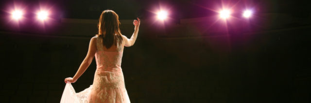 woman performing on stage