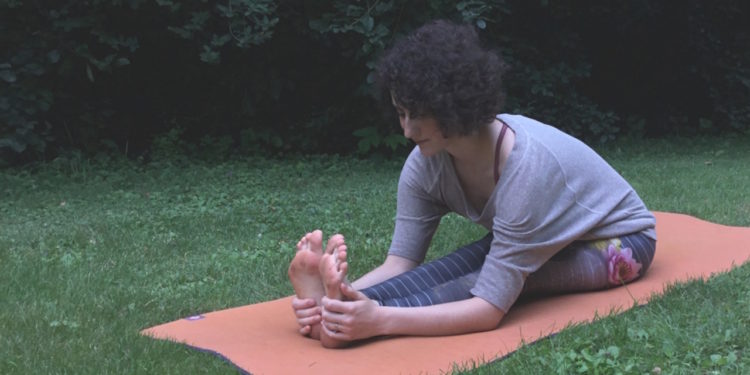 woman doing yoga outside