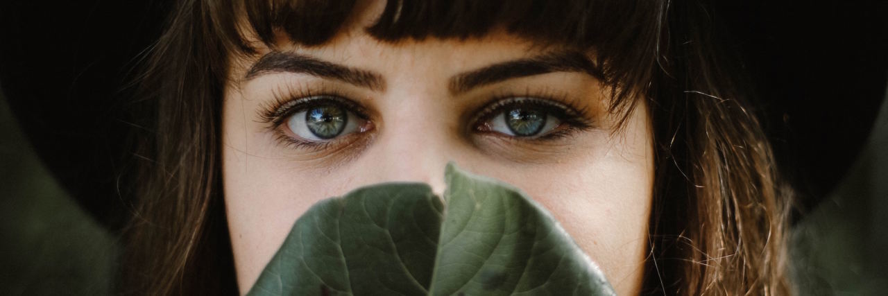 I'm Not Sharing My Sexual Assault Story During #MeToo Campaign woman face behind leaf