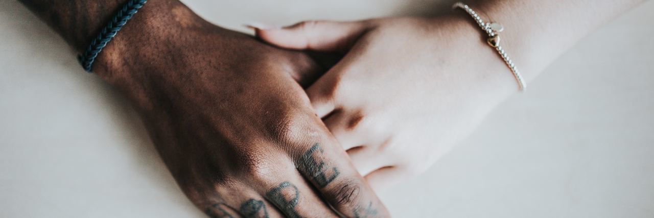 10 Things to Remember on World Mental Health Day two hands holding one another