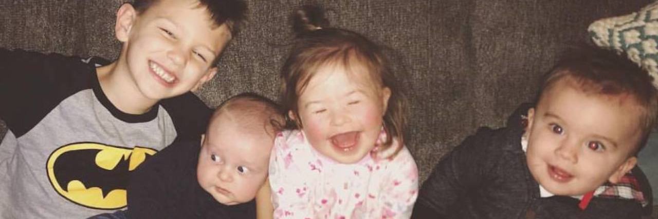 Let Your Child Ask Questions About My Daughter With Down Syndrome Four siblings, the little girl has Down syndrome