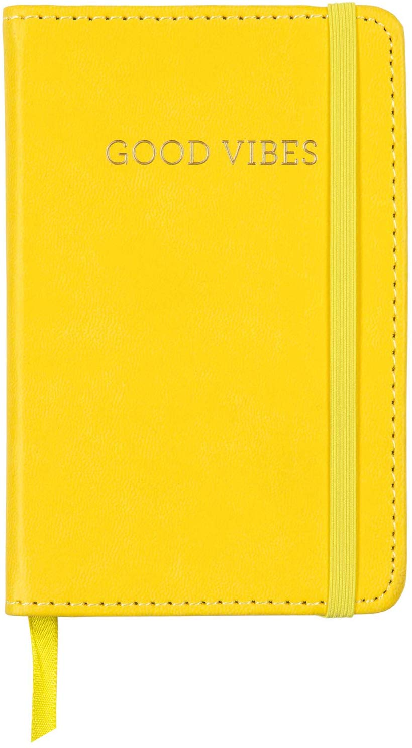 Journal to make notes, helps with brain fog. Yellow leather cover says "Good Vibes."