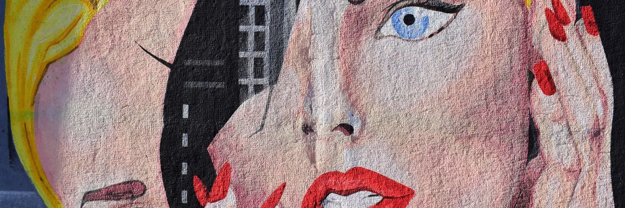 Some Days, I Wish My Depression Was Visible a mural of a woman's face breaking in half