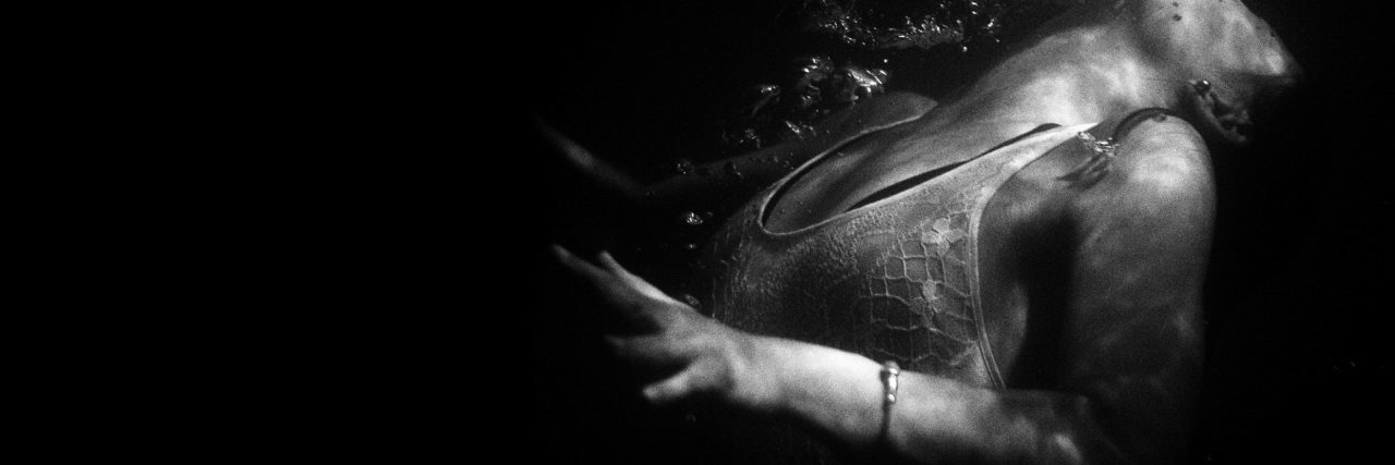 What It's Like to Have a 'Bipolar Breakdown' woman underwater black and white drowning image