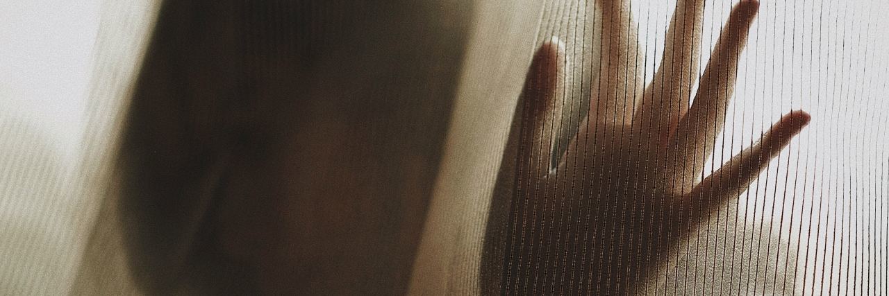 When Body Shame and Disordered Eating Are Connected to Trauma woman behind white curtain