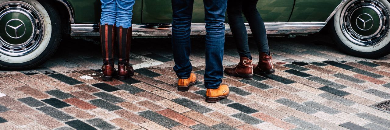 Why We Shouldn't Shame Adults Who Self-Harm three peoples feet stand in front of a car