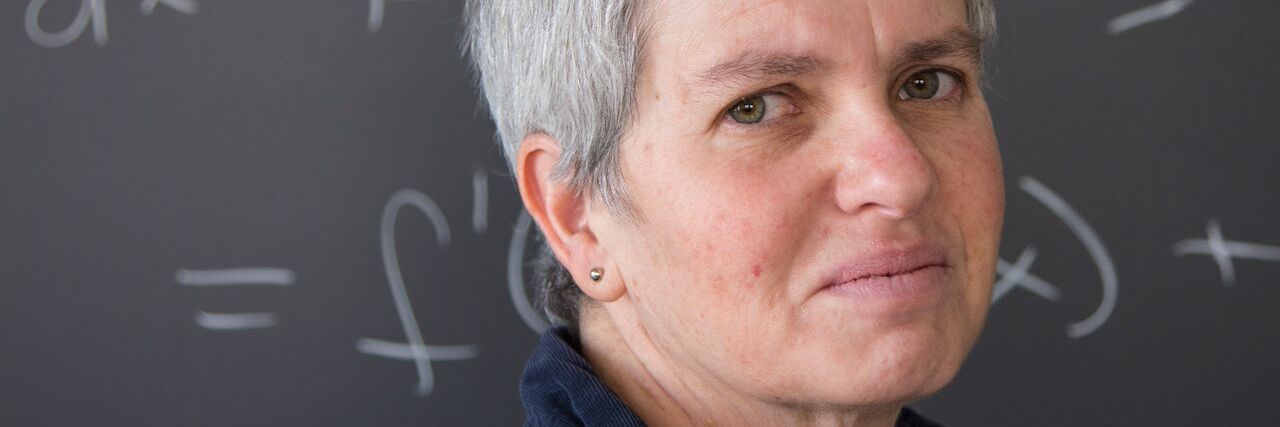 How I'm Navigating Depression After Brain Injury woman with grey hair looks directly at the camera