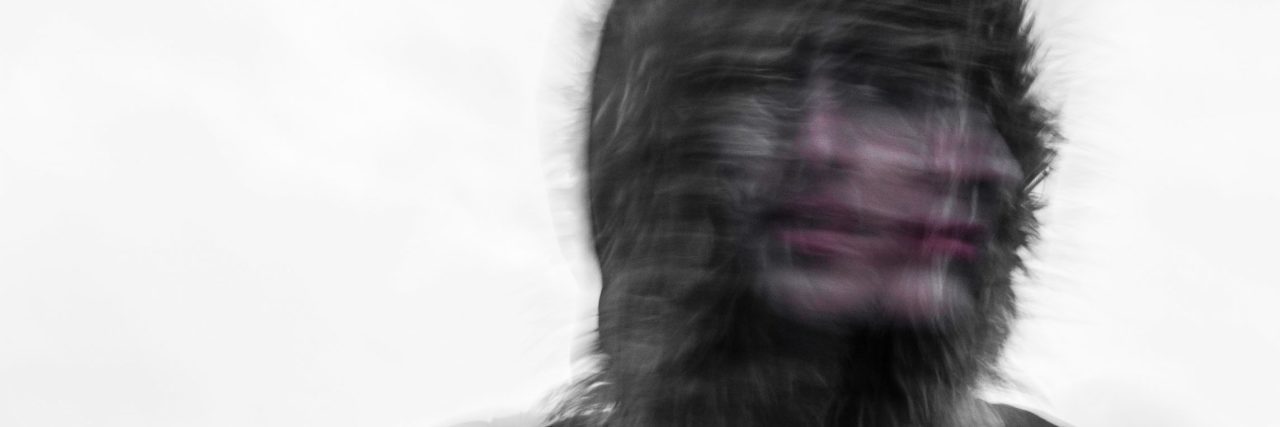 When You're Unsure If Alcohol Is a Friend or Foe distorted double exposure image of woman looking two directions at once wearing hood