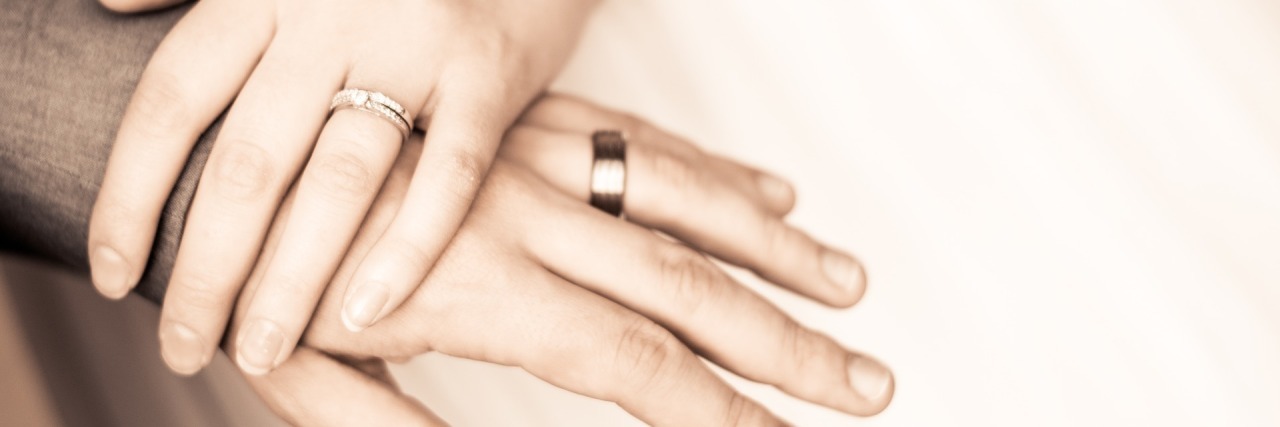 Why My Wife's Schizophrenia Doesn't Matter married couple holding hands close up