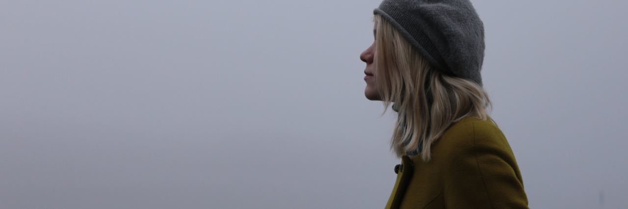 Why I Hate the Word 'Recovery' for Mental Health blonde woman standing in profile in mist