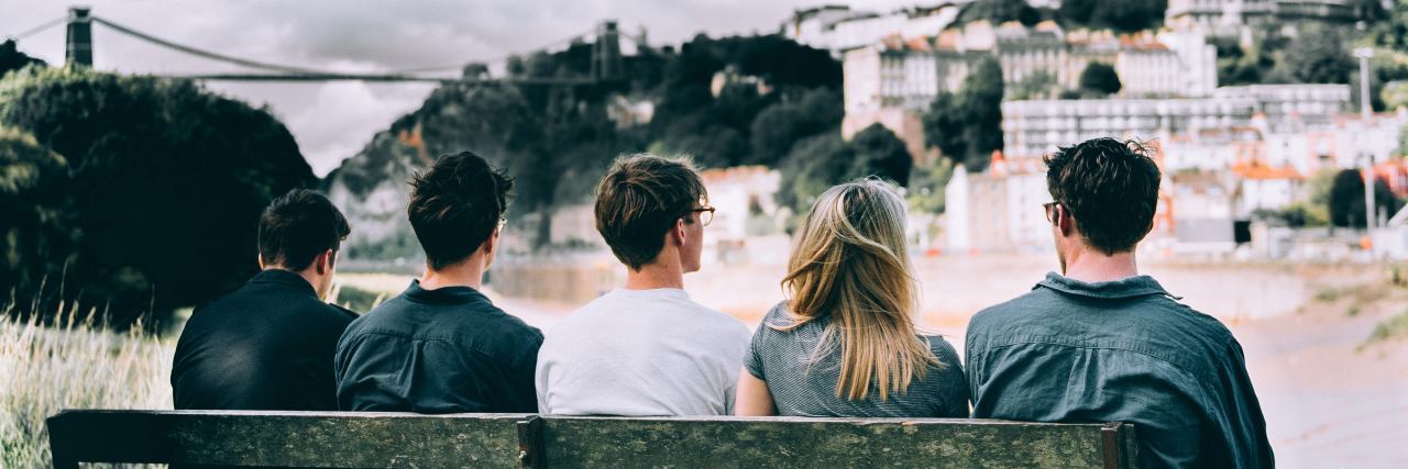 The Strength in Mental Health Support Groups friends sit together on a bench