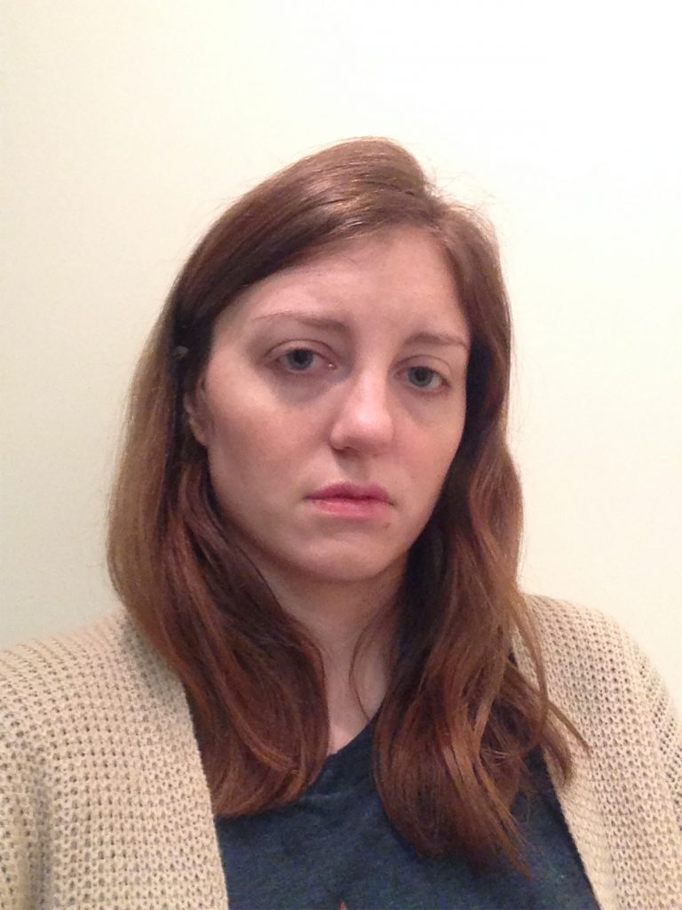 woman looking upset at camera after crying panic attack