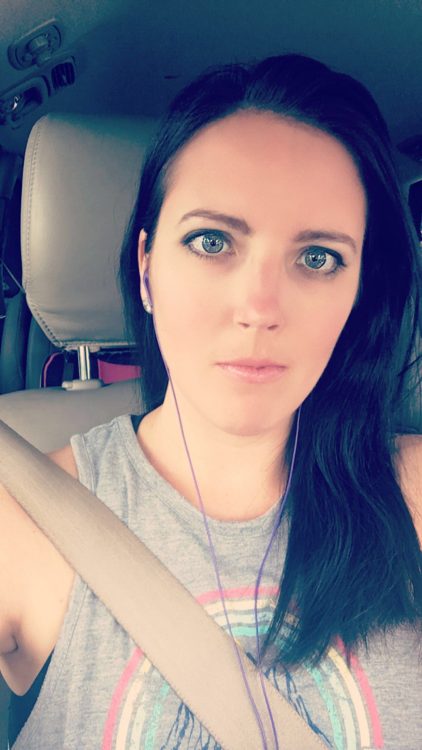 selfie of woman with dark hair in the car