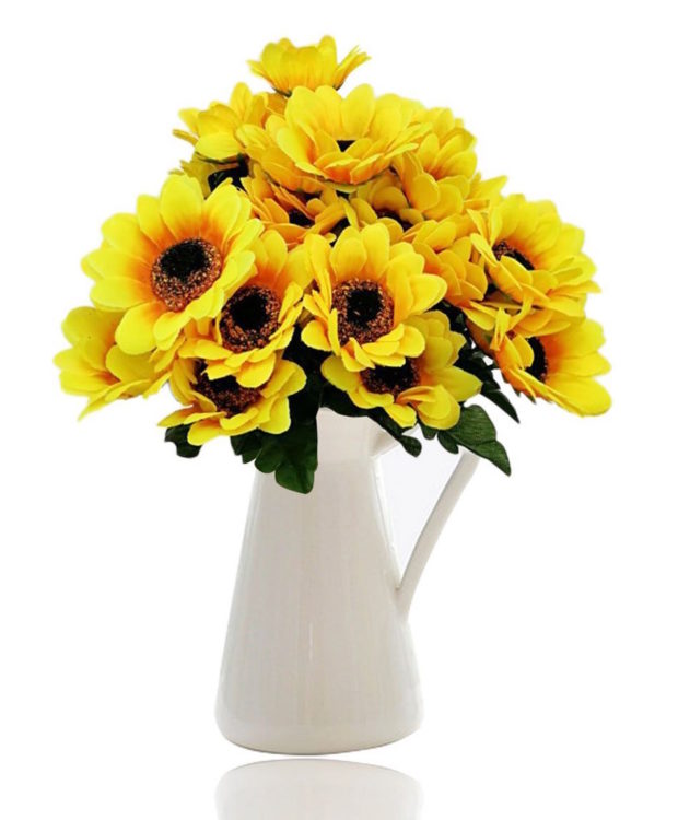 sunflowers in a white handled vase, perfect for someone bedbound because of chronic illness