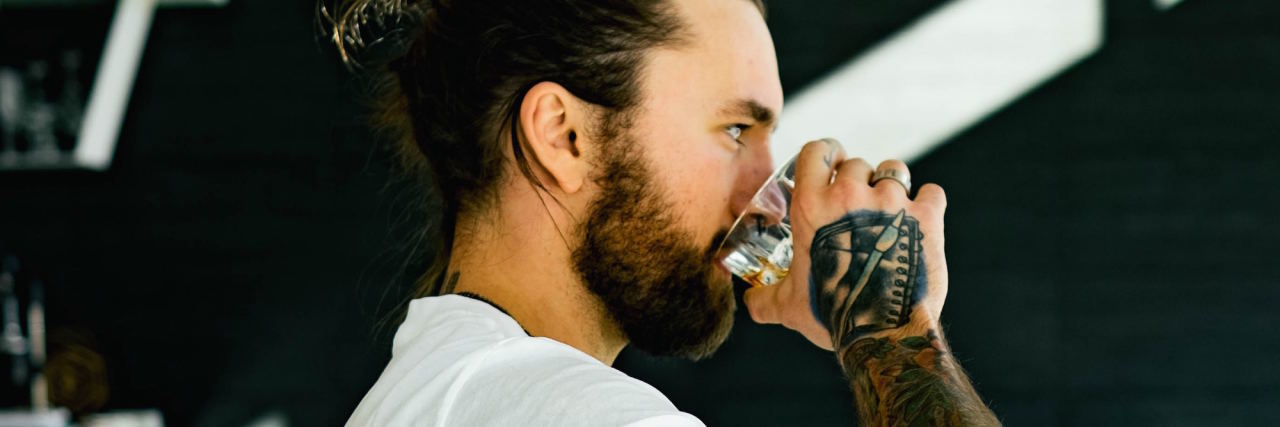 When Your Body Reacts Physically to Your Anxious Intrusive Thoughts man drinking water