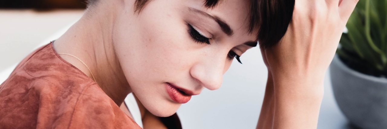 How Social Anxiety Affects Me, and How I Deal With it short haired woman sitting alone looking anxious
