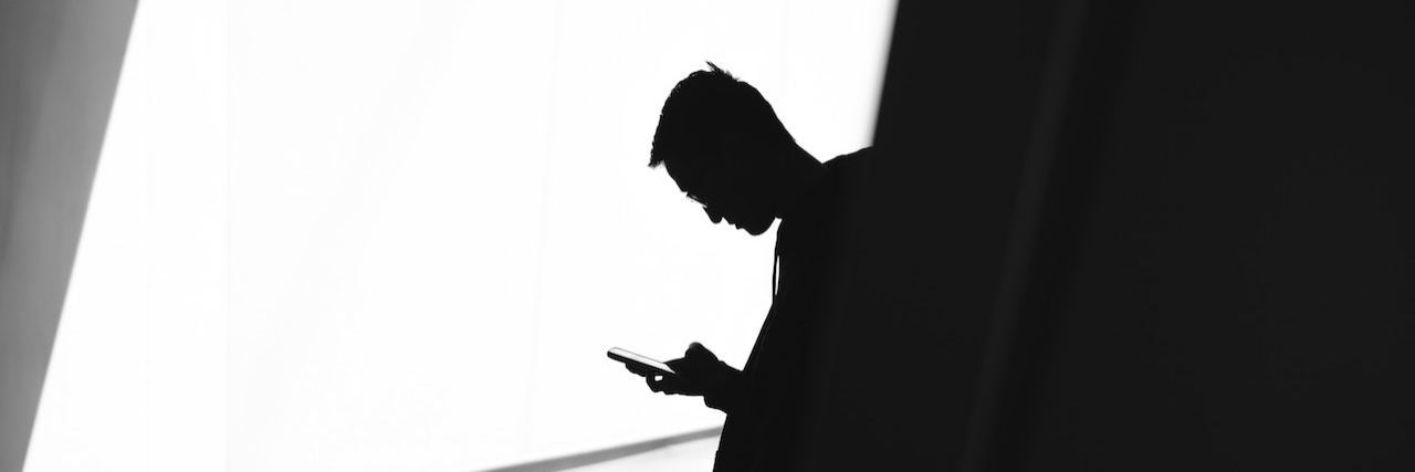 How I Used Social Media to Ask For Mental Health Help man texting