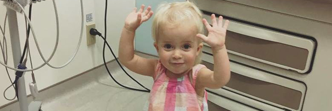 young child dancing in doctor's office