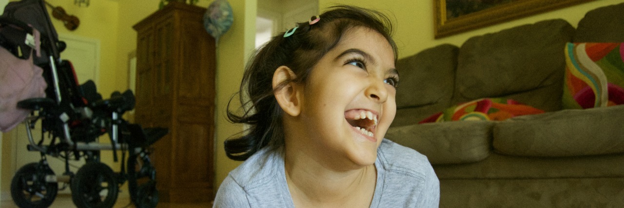 Please Do Not Objectify My Daughter With Disabilities child smiling