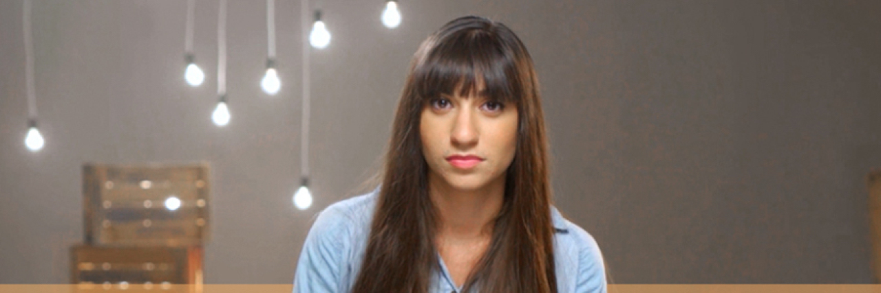 How I Told the World About My Eating Disorder Jewish woman sitting on a chair looking at the camera