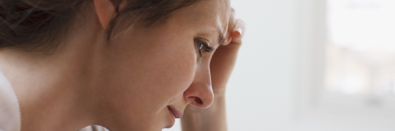 To the Grieving Person Whose Loved Ones Decline Their Dinner Invite Depressed woman with head in hands
