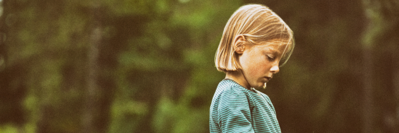 My Childhood With Undiagnosed Autism in 1970s Britain Girl walking along rural road.