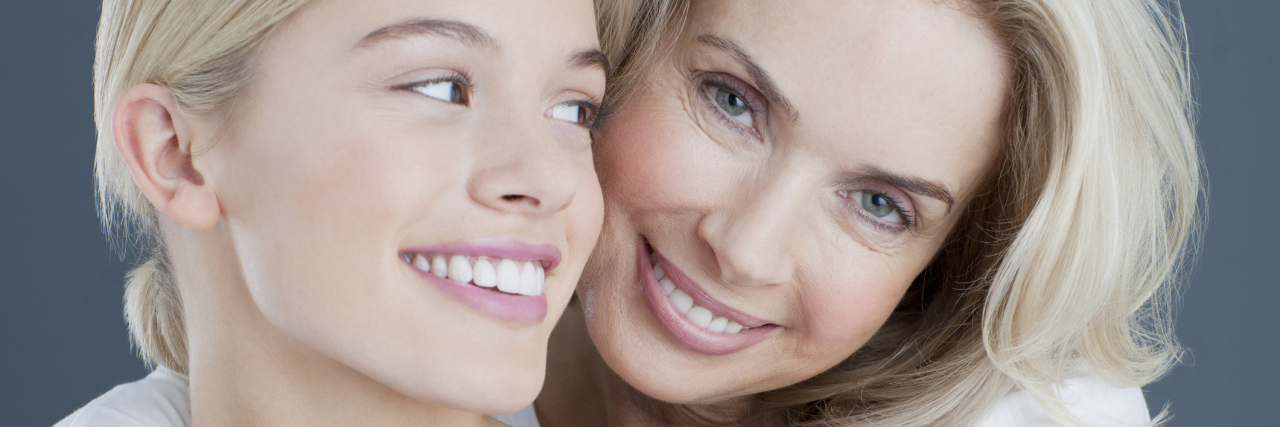 Helping My Child Take Control of Her Healthcare as an Adult A mother and daughter smiling.