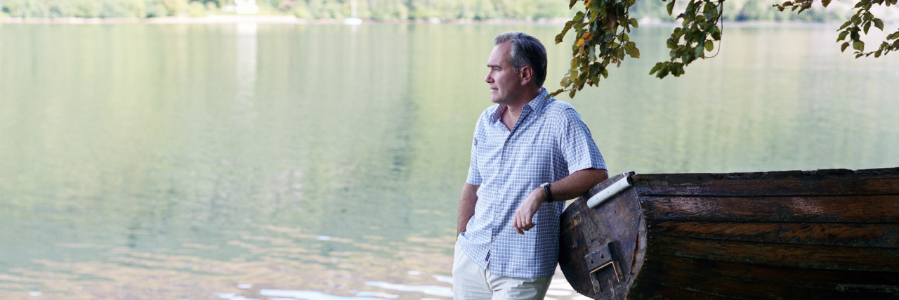 Why I'm Educating Doctors About Lyme Disease and Coinfections man standing outside looking at a river