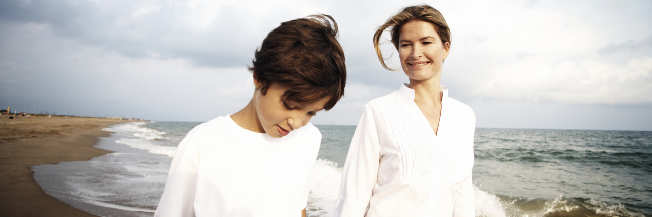 Lessons I've Learned While Supporting My Son With Crohn's Disease A mother and son walking on the beach.