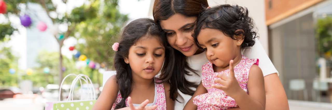 What I Want My Kids to Know About My Multiple Sclerosis mother holding her two young daughters