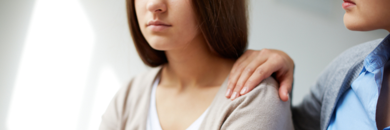 Why Stigma Resistance Is Still Needed in Mental Healthcare female doctor or psychiatrist comforting female patient