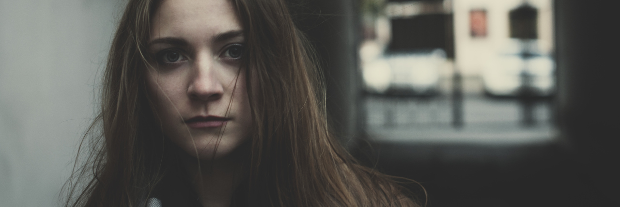 What I Want Others to Know About Conversion Disorder Young pensive long haired sacred girl standing outside alone