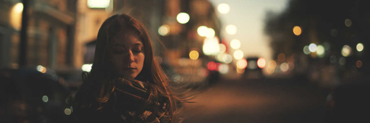 Why Privilege Can't 'Cure' Suicidal Thoughts unhappy woman is walking alone on the night street