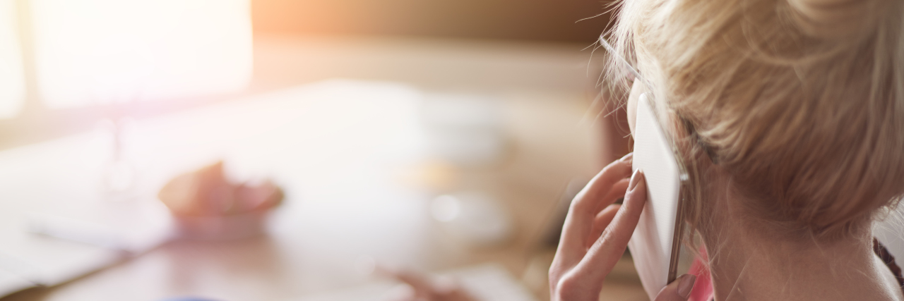 Why I Was Thankful to Be Diagnosed With Crohn's Disease woman talking on the phone