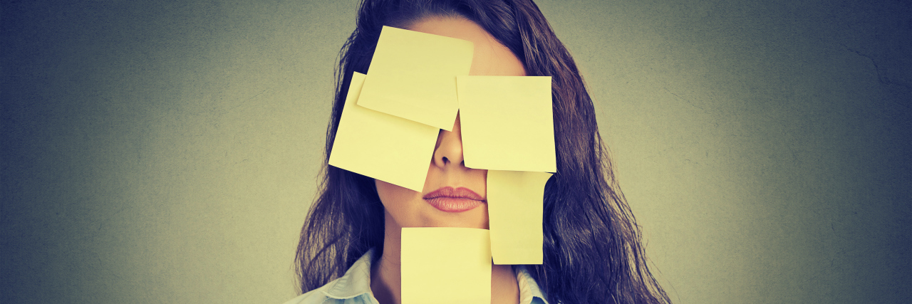 When I'm Told I Shouldn't Let My Disease Define Me Woman who is covered by yellow post-it notes.