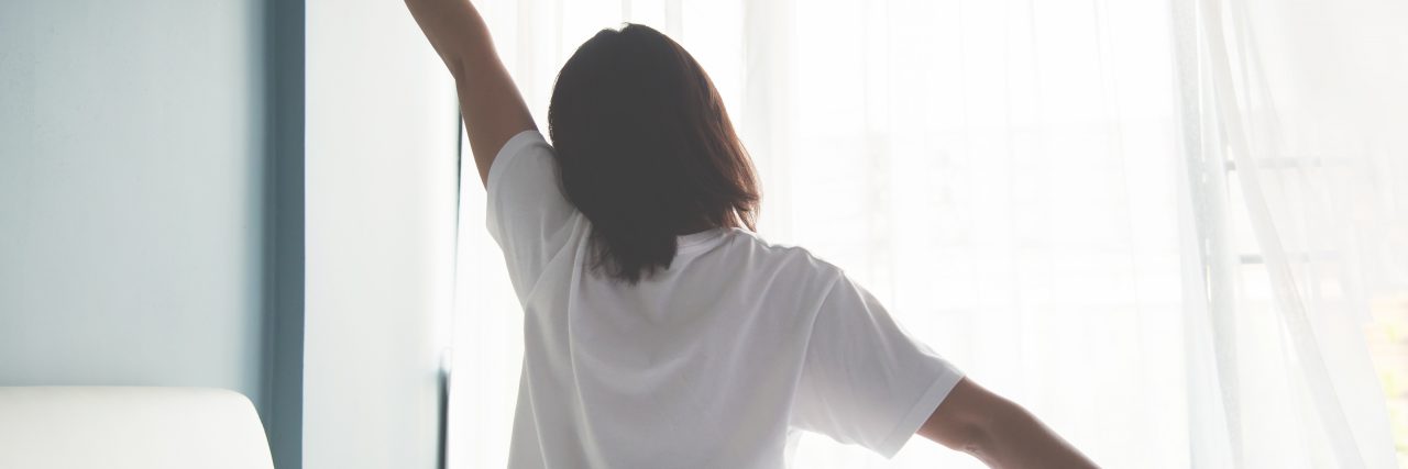 How My Weighted Blanket and Memory Foam Pillow Help My Anxiety woman waking up