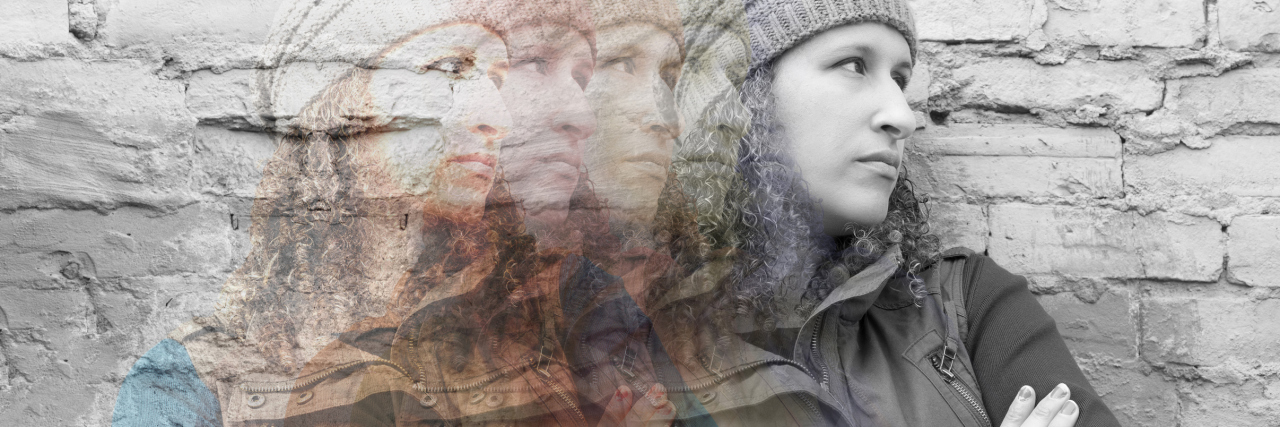 11 Truths You Should Know About 'Multiple Personalities' multiple exposures of young woman against brick wall with arms crossed