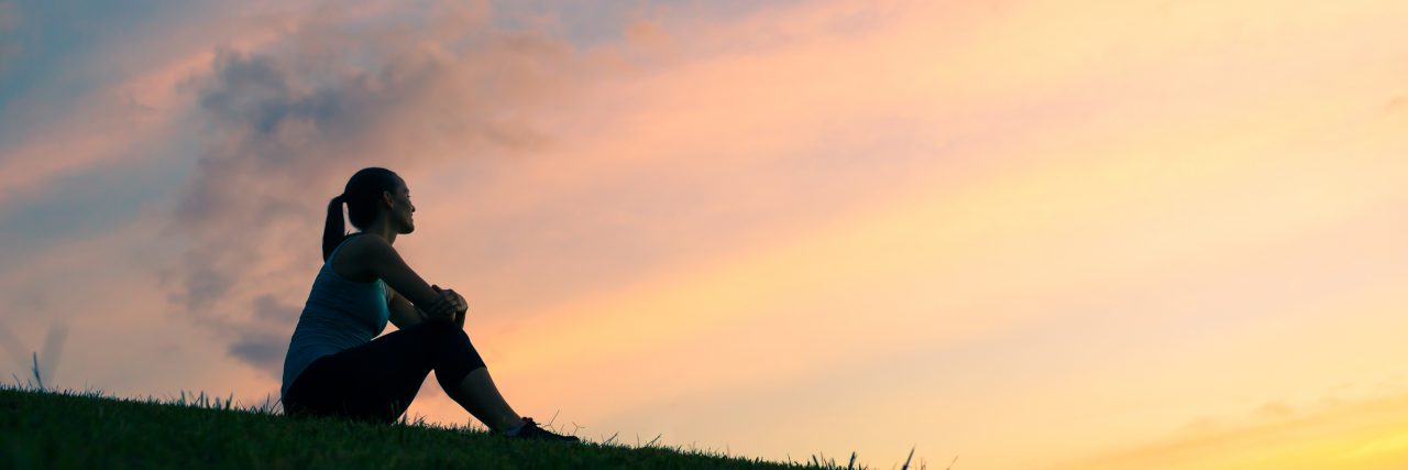 Woman watching sunset