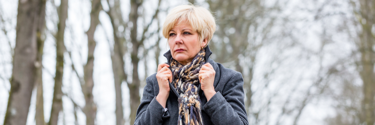 Emotional Effects of Hypoglycemia From Type 2 Diabetes woman walking outside in the snow looking upset