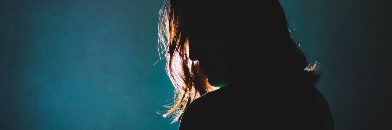I Don't Want to Be Touched As Someone Whose Experienced Physical Abuse silhouette of depress woman standing in the dark with light shine behind