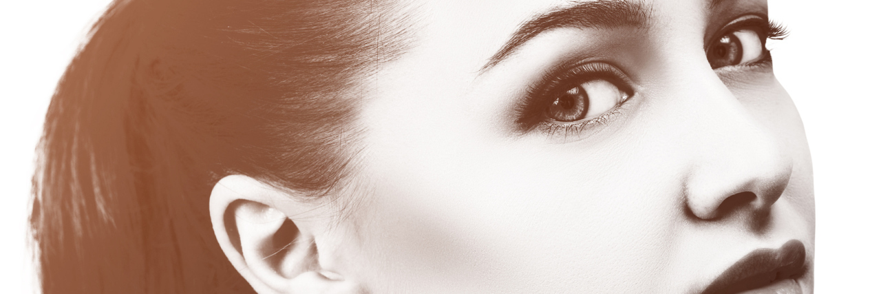 When Depression Creeps Up on You Again Beautiful young woman with clean skin and perfect makeup over white background.