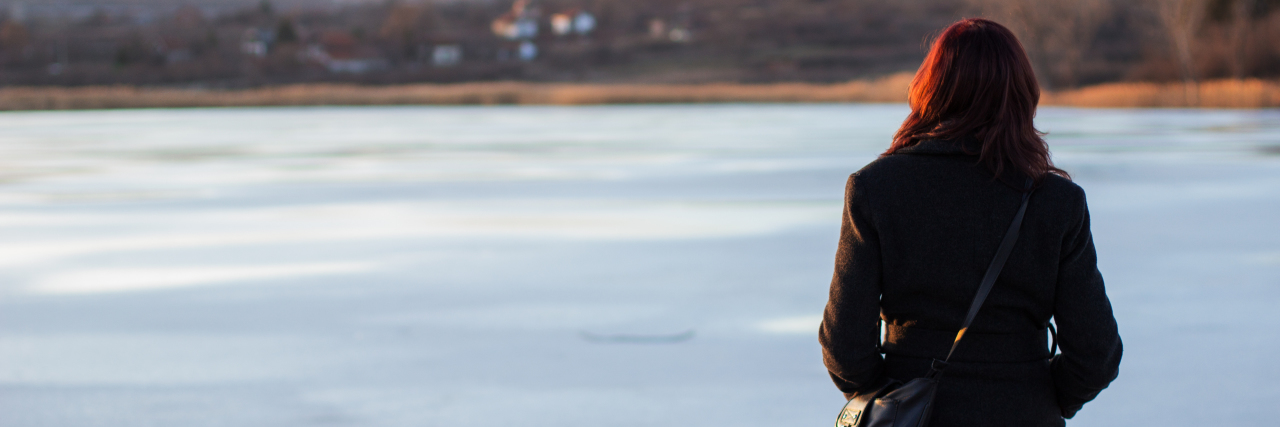 What It's Like Facing a Breast Cancer Diagnosis During the Holidays Girl on the frozen lake.