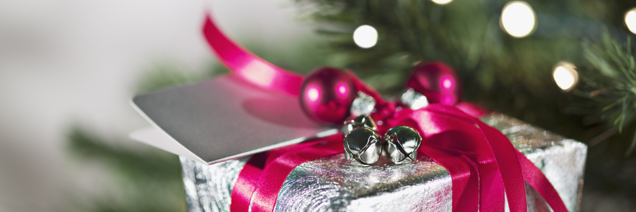 Christmas Gift Ideas for Someone With Chronic Pain and Illness christmas present underneath the tree