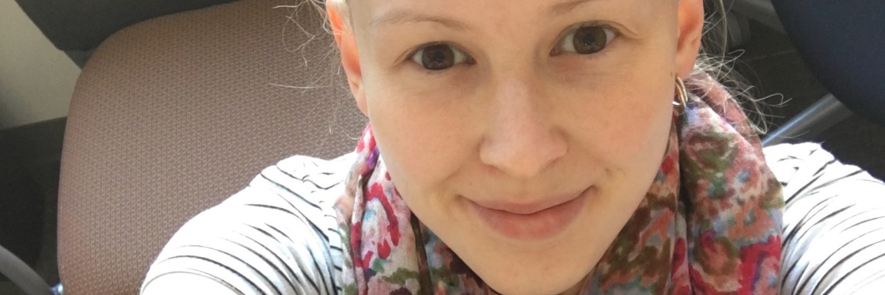 Forget What Others Think – Do What Helps Your Chronic Pain The writer sitting on a heat pack.