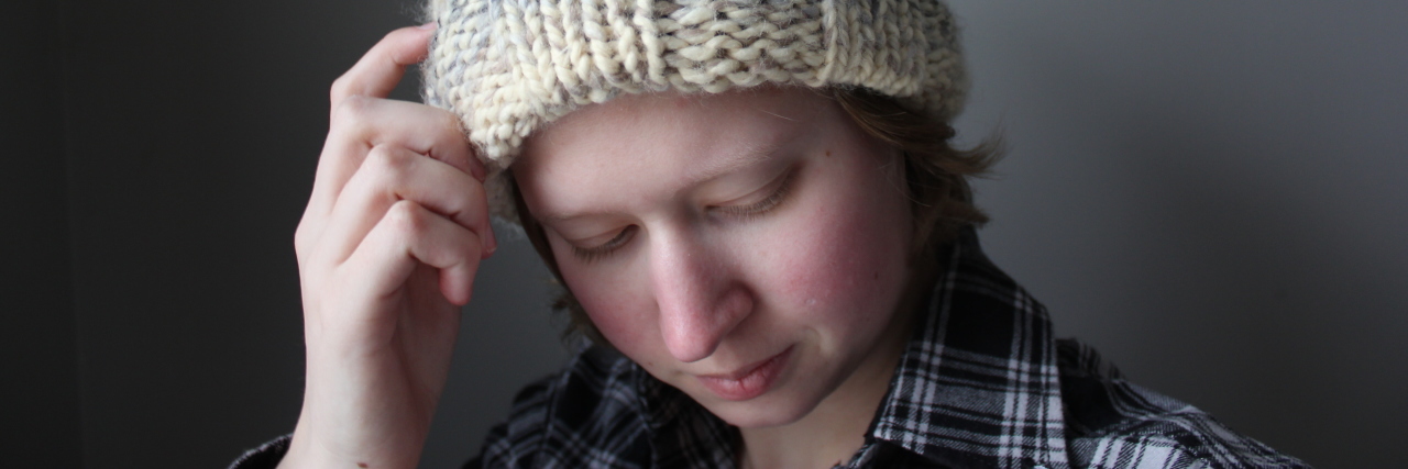 My Coping Mechanisms for Chronic Daily Headaches woman wearing a knit hat